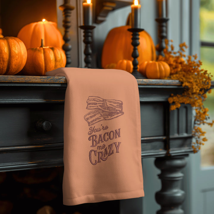 Photograph of a hand towel featuring You're Bacon Me Crazy design