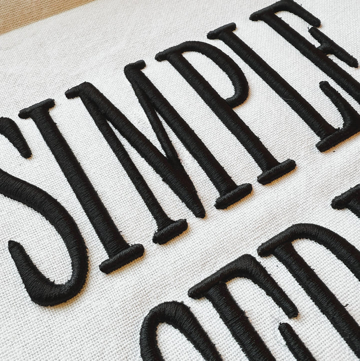 Close up photograph of stitched out Simple Serif Puff embroidery font