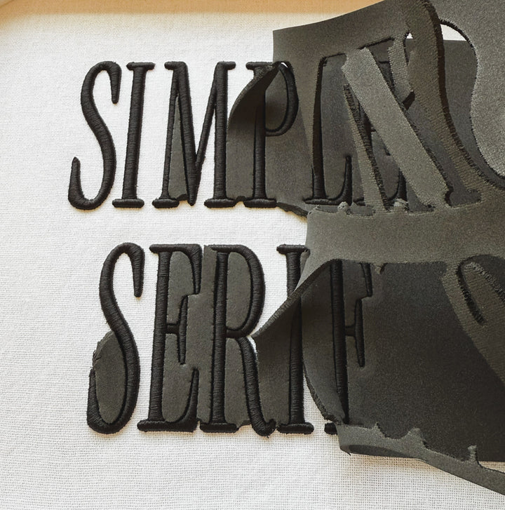 Close up photograph of stitched out Simple Serif Puff embroidery font