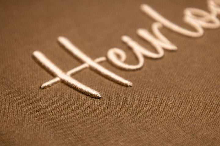 Close up photograph of stitched out Heirloom Puff embroidery font