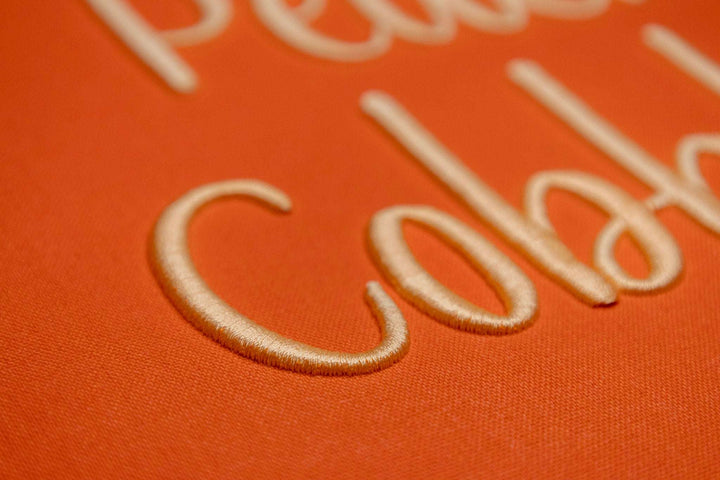 Close up photograph of stitched out Peach Cobbler Puff embroidery font
