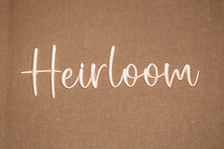 Close up photograph of stitched out Heirloom Puff embroidery font
