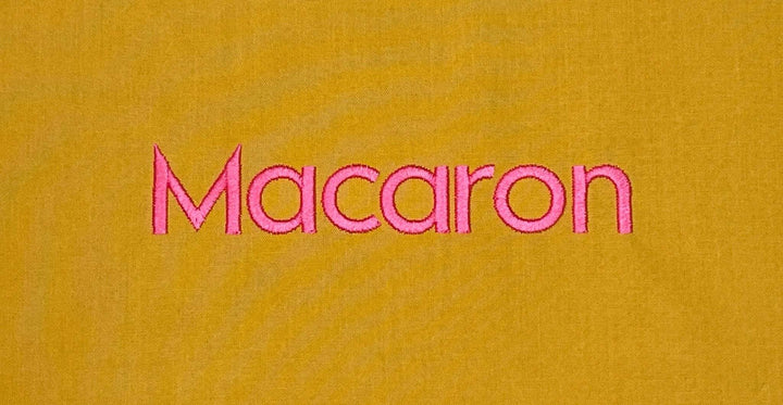 Photograph of stitched out Macaron embroidery font
