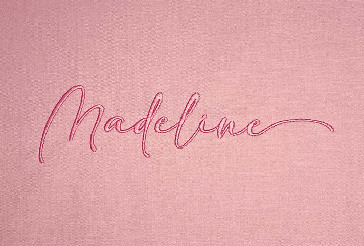 Photograph of stitched out Madeline  embroidery font