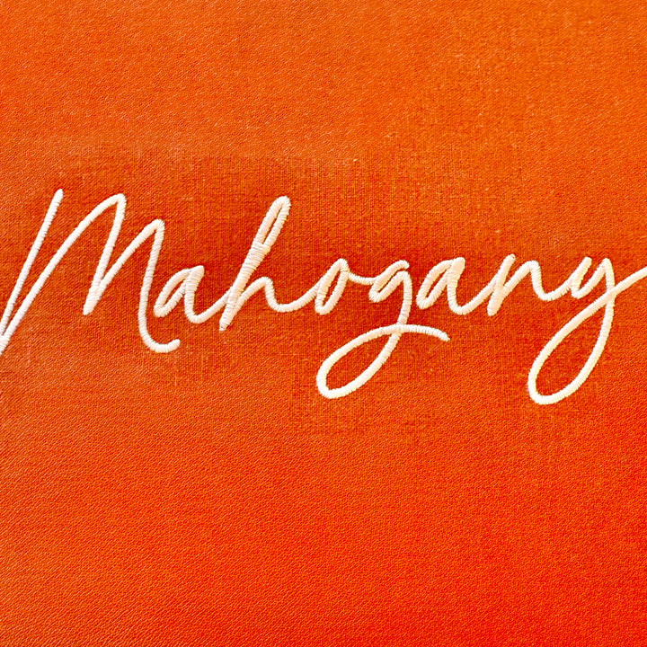 Photograph of stitched out Mahogany embroidery font
