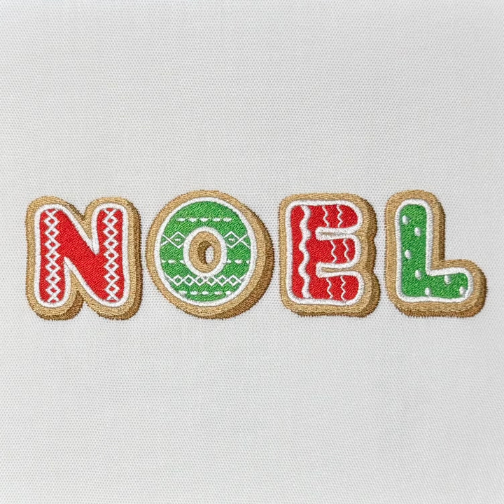 Close up photograph of stitched out Royal Icing embroidery font