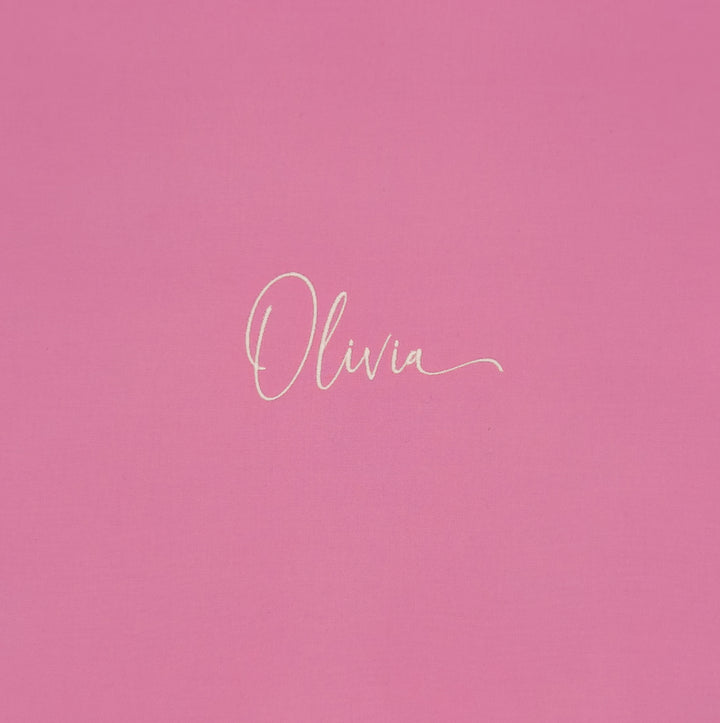 'Olivia' stitched out in on a pink background