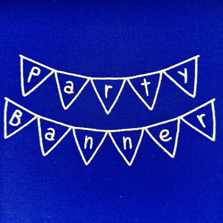 Close up photograph of stitched out Party Banner embroidery font