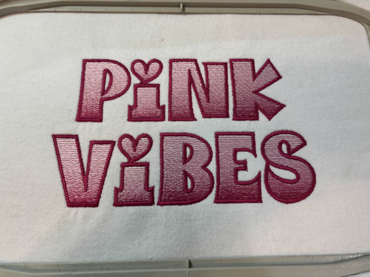 Photograph of stitched out Pink Vibes embroidery font