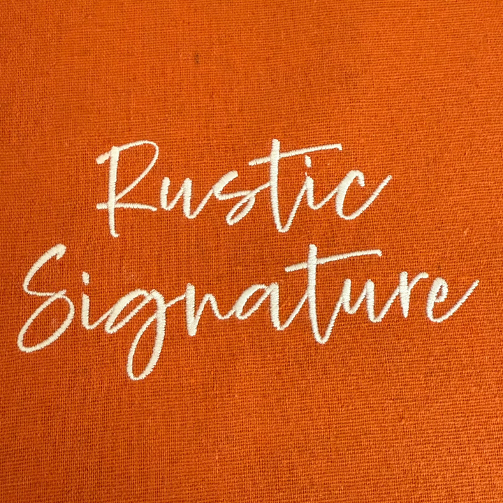 Photograph of stitched out Rustic Signature embroidery font