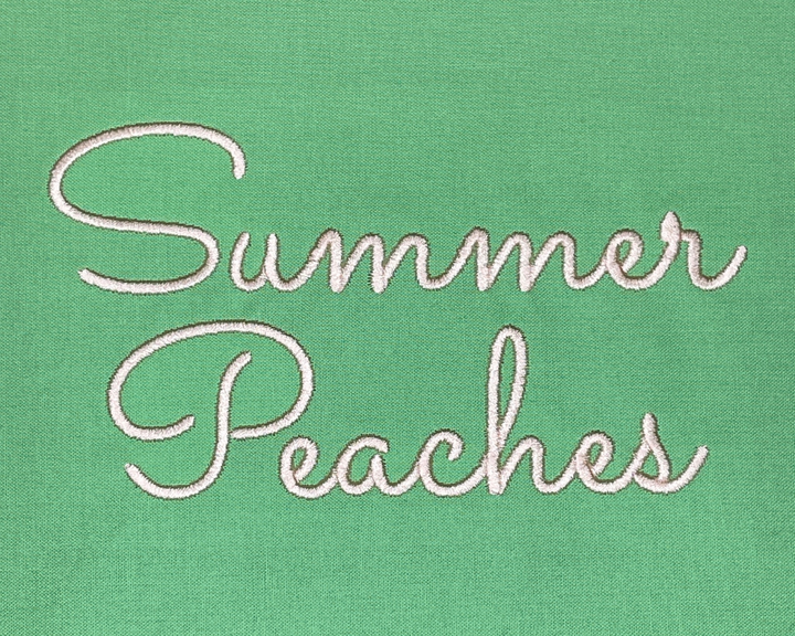 Photograph of stitched out Summer Peaches embroidery font