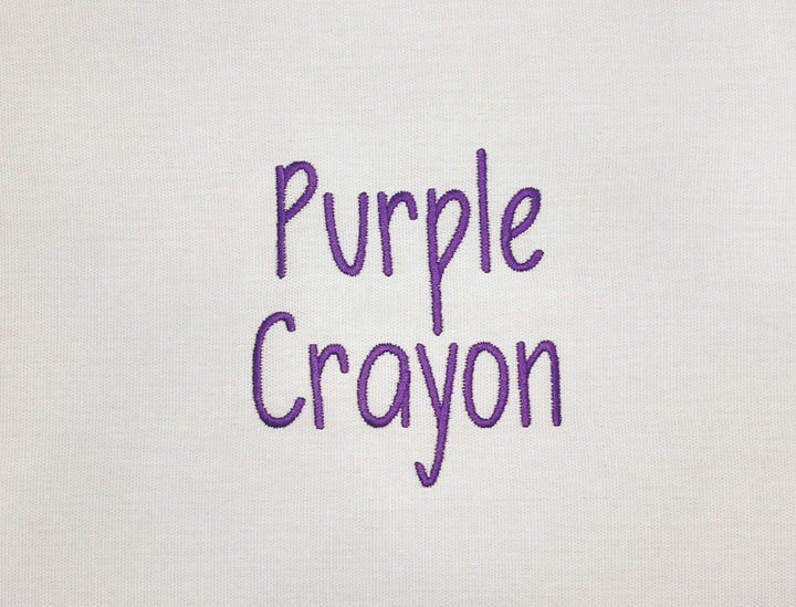 Photograph of stitched out Purple Crayon embroidery font