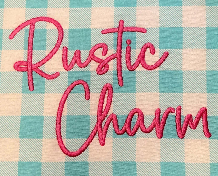 Photograph of stitched out Rustic Charm embroidery font